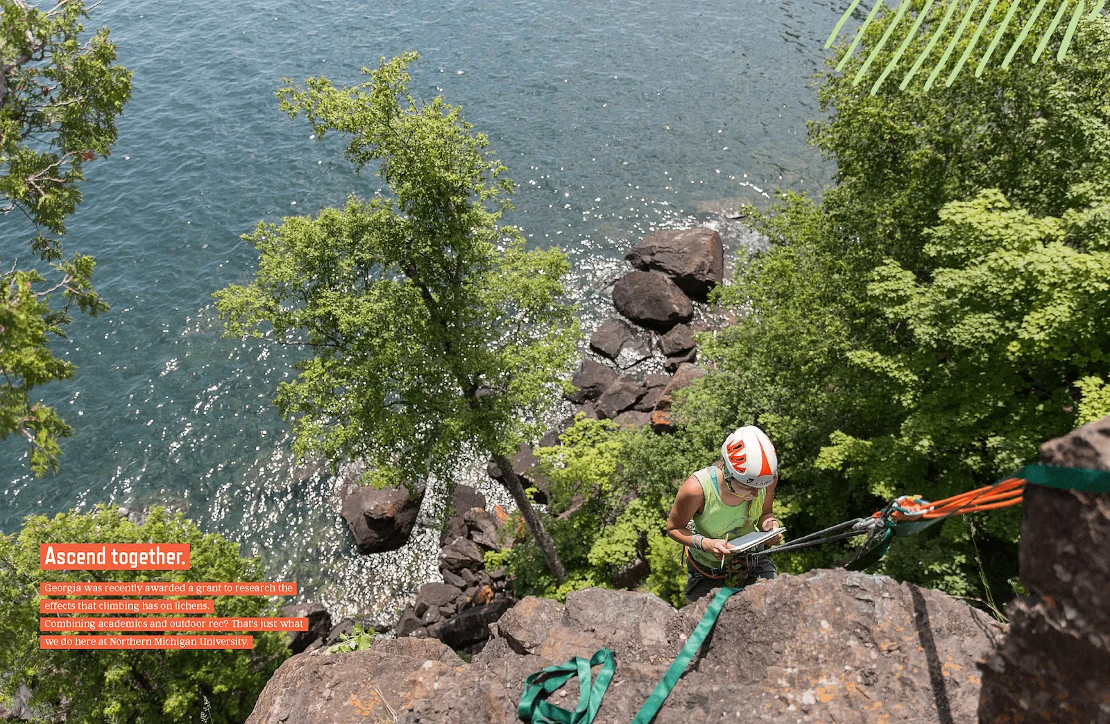 Spread of magazine featuring climber on cliff face