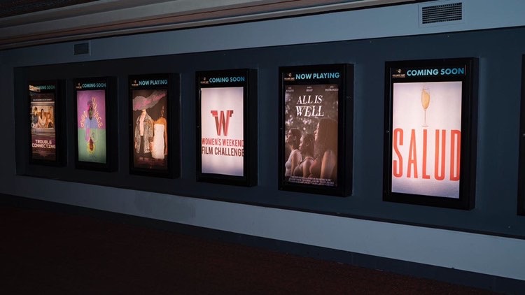 Backlit posters at Salud premiere