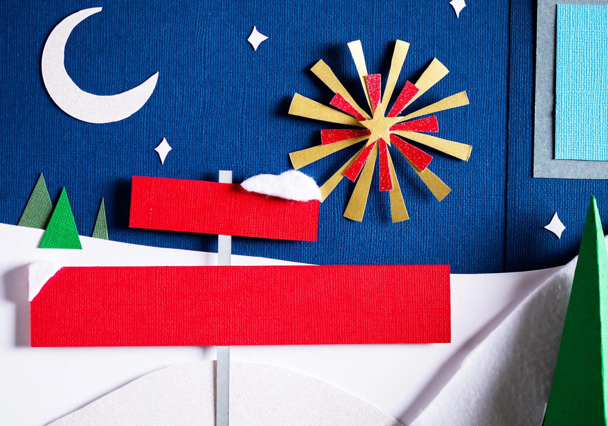 Detail shot of paper sign and felt snow